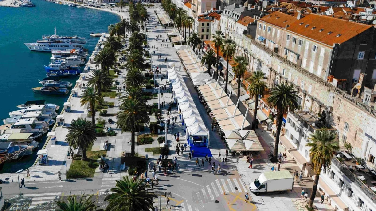 Aerial view of Split's palm-lined Riva promenade hosting Startup Europe Regatta 2024.