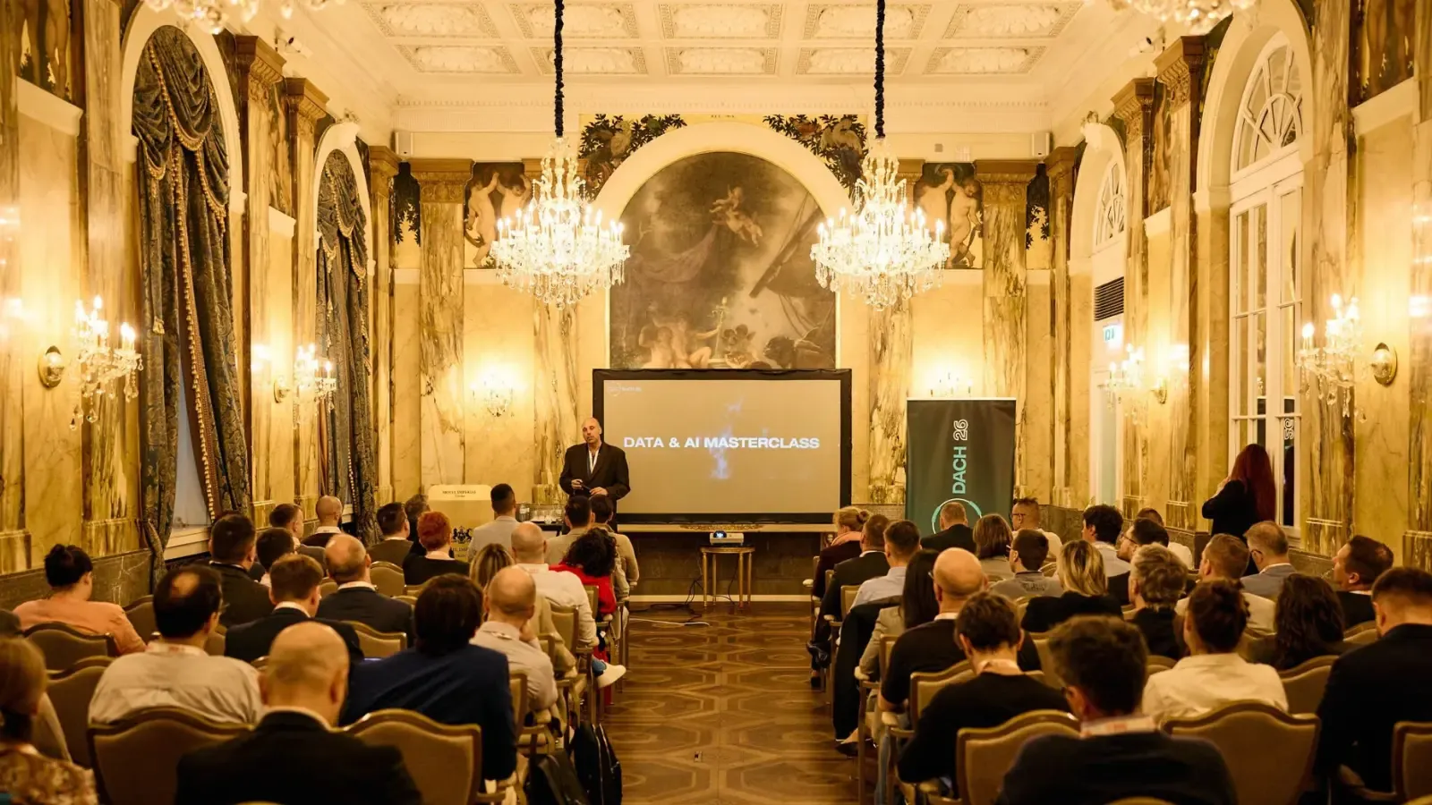 Speaker presenting the Data & AI Masterclass to a full audience at Hotel Imperial, Vienna.