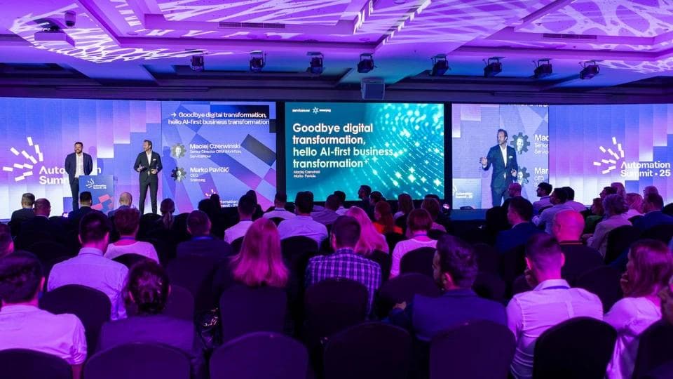 People in the audience of a business IT conference.